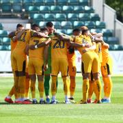 TOGETHER: The Newport County players in a pre-match huddle before Saturday's draw with Exeter City