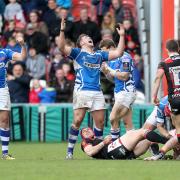 UPSET: Elliot Dee and Charlie Davies celebrate the Dragons' European quarter-final win in Gloucester