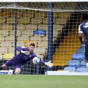 MOVE: Goalkeeper Tom King, pictured saving a penalty for County at Southend, has signed for Salford
