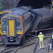 Investigators at the scene of a crash involving two trains near the Fisherton Tunnel between Andover and Salisbury in Wiltshire (Credit: PA)