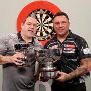 Gerwyn Price and Peter Wright pose with their trophies after the final match at the Aldersley Leisure Village, Wolverhampton. Picture date: Sunday November 21, 2021. PA Photo. See PA story DARTS Wolverhampton. Photo credit should read: Bradley Collyer/PA