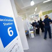 Nurses working at a vaccination site in Liberty Shopping Centre, Romford, east London, as the Government accelerates the Covid booster programme to help slow down the spread of the new Omicron variant. (PA)