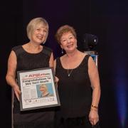 winner: Terri Booth, left, collects her award