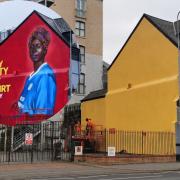 The 'My City My Shirt' mural in Cardiff Bay was painted on the side of Mischief's on James Street.