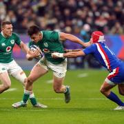 Ireland's Dan Sheehan attempts to escape the tackle from France's Gabin Villiere (right) during the Guinness Six Nations match at the Stade de France, Paris.  Picture PA