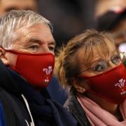 Rugby fans wearing Welsh Rugby Union face coverings during an autumn international match in 2021. Picture: Huw Evans Picture Agency