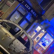 The burned out Nissan Micra that crashed into a nail studio in Pontnewydd, Cwmbran. (Picture: Lux Nail Studio)