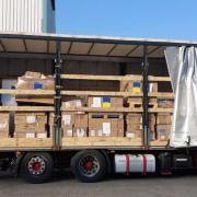 A lorry carrying aid for Ukraine and, inset, Dr Sergey Tadtayev