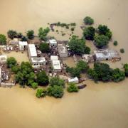 Houses and narrow surrounding are are left amid flooded waters in Kot Addu, Pakistan