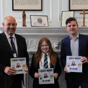 St Alban's RC High School headteacher Steven Lord, author and pupil Lucie-Marie Phillips, and council leader Cllr Anthony Hunt. Picture: Torfaen council.