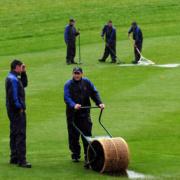UNSUNG HEROES: The Celtic Manor ground staff clear the water from the course