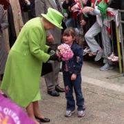 The Queen is given flowers on a visit to Newport in 2002.