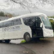 A bus stuck in a village lane above the Heads of the Valleys road, near Gilwern.