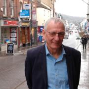Cllr Paul Griffiths pictured during an earlier visit to Monnow Street in Monmouth.