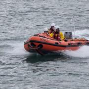 Tenby RNLI's inshore lifeboat was launched after reports that a woman was cut off by the tide.