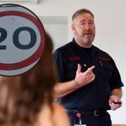 A fire and Rescue Officer presenting at educational course