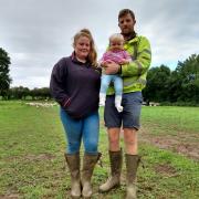 Farmers Shauna and Denis Waters, with baby Winnie, say they face an uncertain future now land they farm is being considered as a potential Gypsy Traveller site.