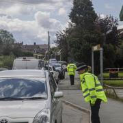 Police officers stopping cars in 20mph zone