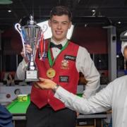 Liam Davies has become a double world champion in snooker
