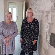 Glenys Williams (left) (pictured with her sister Sylvia) has been left homeless after a major leak was discovered on her roof
