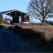 The new car park will be located to the right of this barn.