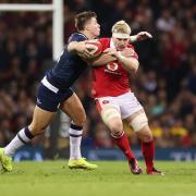 030224 - Wales v Scotland, Guinness Six Nations 2024 - Aaron Wainwright of Wales takes on Huw Jones of Scotland. Picture: Huw Evans Picture Agency