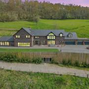 This luxury home includes paddocks and nine acres of land in Langstone