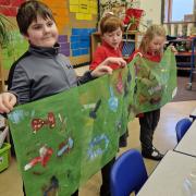 Students created a banner at Kymin Primary School