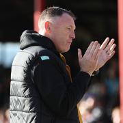 FRUSTRATED: Graham Coughlan applauds the County fans after the defeat at Grimsby
