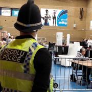 A police officer keeps watch at the Gwent Police and Crime Commissioner election count.