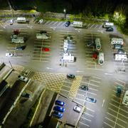 This drone image shows camper vans and caravans in the Dell car park, Chepstow.