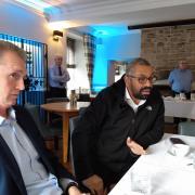 David Davies, left, and James Cleverly talking to reporters at the Three Salmons Hotel in Usk.