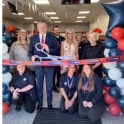 Staff members (store manager Kay Gregory far left) at One Stop Pontnewydd with Labour parliamentary candidate for Torfaen Nick Thomas-Symonds as the official launch ribbon is cut