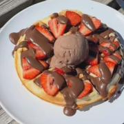 A freshly made waffle topped with strawberries and chocolate sauce is served at the Fferm Gelli café, proving hard to resist after a walk around the farm.