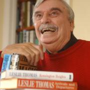 NEWPORT AUTHOR LESLIE THOMAS IN HIS STUDY WITH A SMALL SELECTION OF HIS 26 NOVELS AND 5 TRAVEL BOOKS. (5993040)