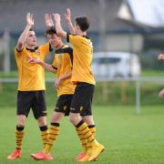 HIGH FIVES: The County under-18s boys celebrate one of eight goals against Taffs Well last Sunday