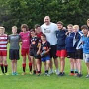 STAR COACH: Former Wales international Craig Quinnell, centre, with members of the Pontypool United Under 14s squad