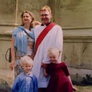 The Reverend Justin Groves,46, with his wife Lucy and children Zoe and Toby on the day of his ordination in 2002