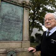 VETERAN: Henry West at the Caerleon war memorial, wearing his Number 25 Squadron jersey and tie