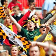 SUPPORT: Newport County fans cheering their side on to promotion at Wembley in the 2013 Conference play-off final