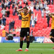 DESPAIR: Newport County striker Padraig Amond shows the pain of defeat to Tranmere Rovers in the League Two play-off final at Wembley