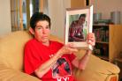 SEARCHING: Kyle Vaughan’s mum, Mary, holds a picture of her son
