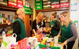 File photo showing staff at a foodbank in Newport. The city council warns inflation and a surge in demand could hit foodbank organisations this winter.
