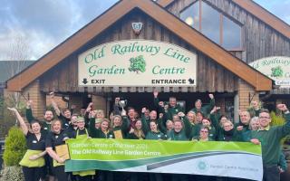 Staff at the Old Railway Line Garden Centre celebrate being named the best in the UK