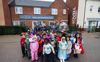 The children from St Michaels R.C. Primary School outside the show home