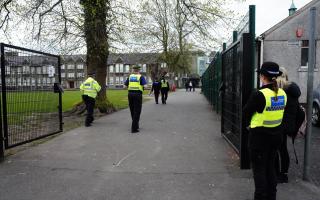 Police at Ysgol Dyffryn Aman in Carmarthenshire in April after two adults and a pupil were injured.
