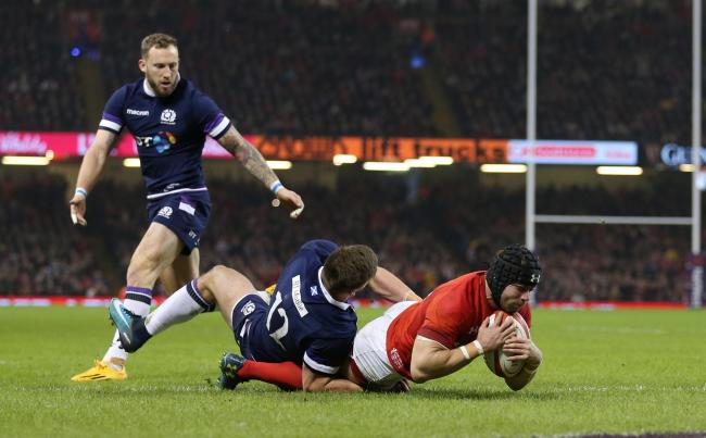 TRY TIME: Leigh Halfpenny dives over for Wales' second try