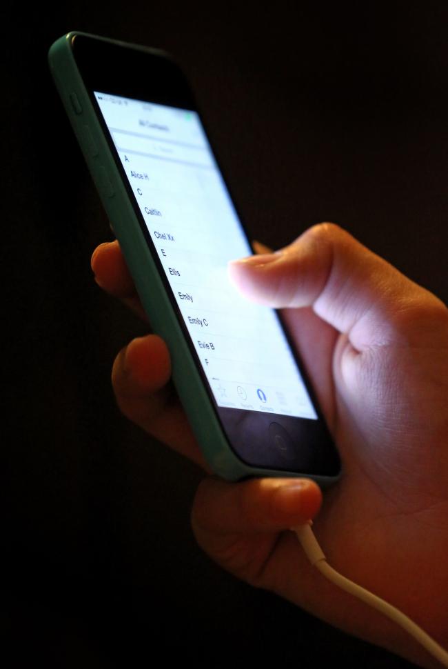 Embargoed to 0001 Tuesday July 03..File photo dated 22/10/14 of someone using a mobile phone. The latest figures from Childline show that the NSPCC-supported service delivered 4,636 counselling sessions for loneliness in 2017/18 - a 14% rise on the previo