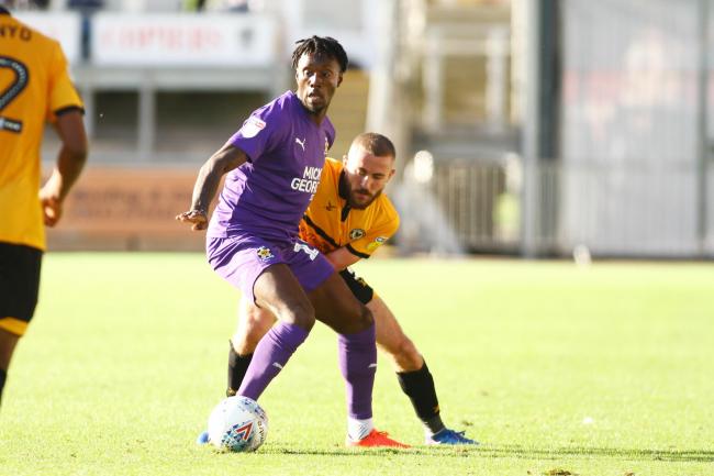 SIGNED: Adebayo Azeez in action for Cambridge United against Newport County earlier this season