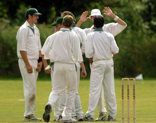 Chepstow celebrate the opening wicket of Marc Collins taken off the bowling of Rhodri Fawsitt